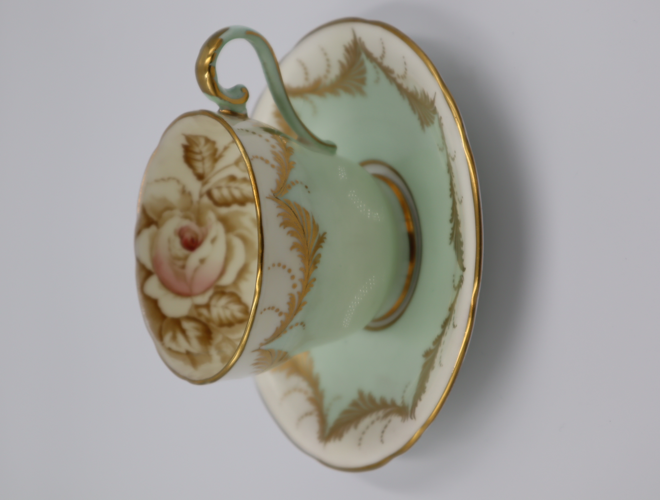 Aynsley green and gold cup and saucer