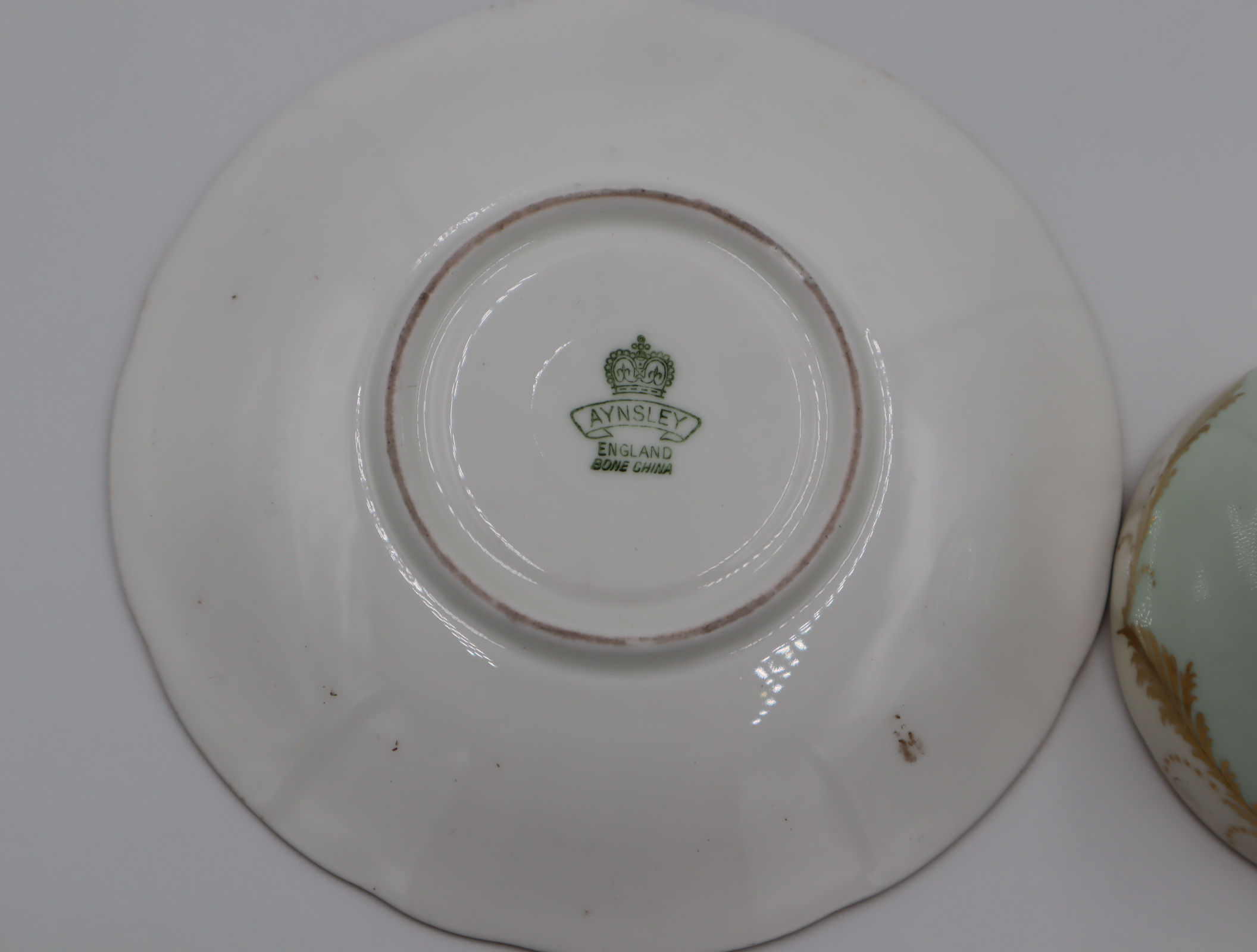 Aynsley green and gold cup and saucer