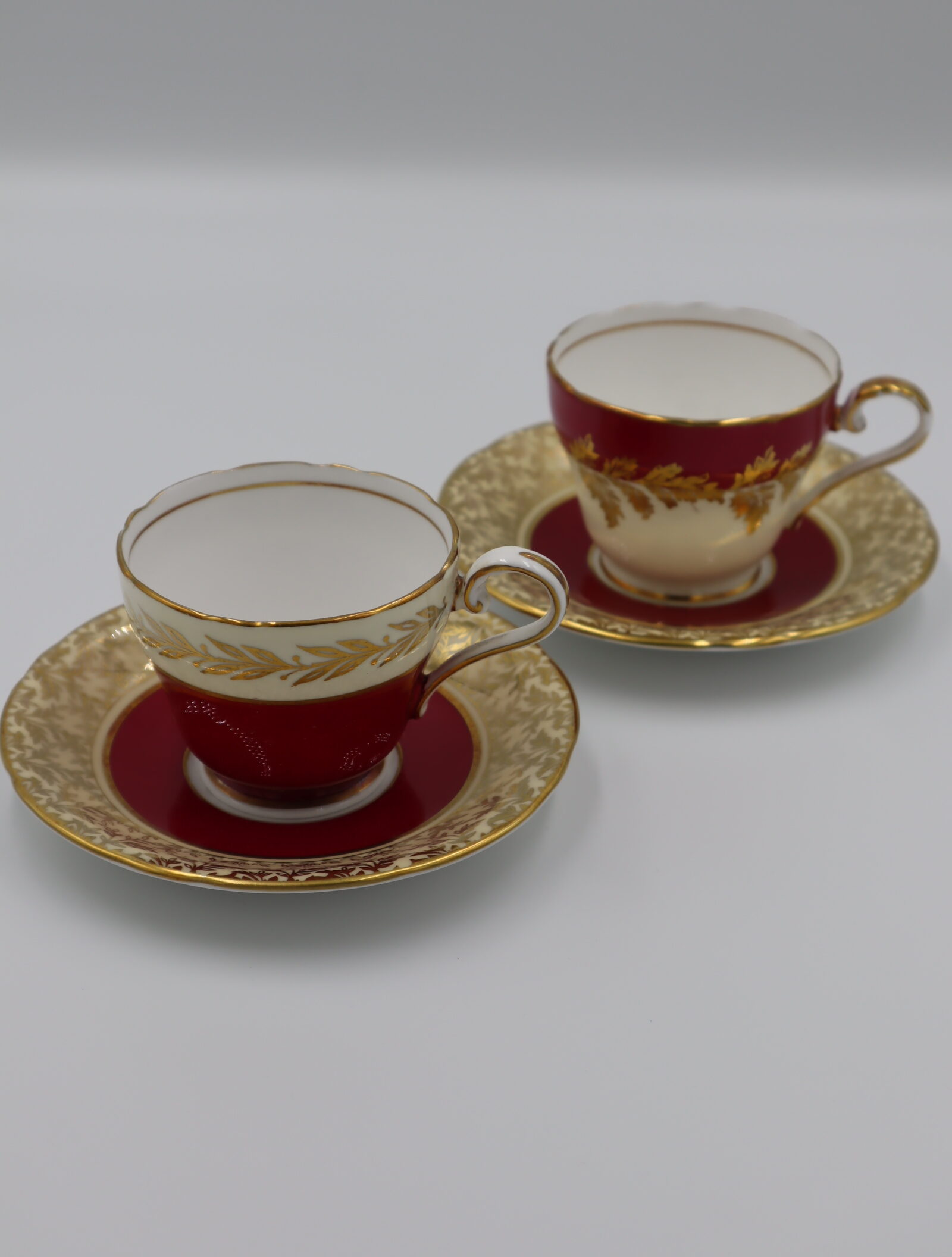 Aynsley Tea cup and Saucer set , individual red and gold patterns